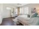 Bedroom features hardwood floors, queen size bed, built in shelving, and a ceiling fan at 8478 Karrer Ter, Orlando, FL 32827