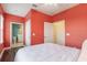 Bedroom with a queen bed and ensuite bathroom perfect for guests at 8478 Karrer Ter, Orlando, FL 32827