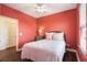 Charming bedroom with queen bed, ceiling fan and window bringing in natural light at 8478 Karrer Ter, Orlando, FL 32827