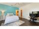Bedroom features hardwood floors, a queen size bed, modern decor, and an office in the corner at 8478 Karrer Ter, Orlando, FL 32827