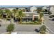 Exterior shot of a well-maintained fitness center with palm trees and manicured landscaping at 8478 Karrer Ter, Orlando, FL 32827