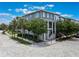 Beautiful three-story townhome showcasing lush landscaping, modern architecture, and a inviting entrance at 8478 Karrer Ter, Orlando, FL 32827