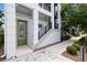 Inviting front entrance featuring a staircase, modern design, and well-maintained landscaping at 8478 Karrer Ter, Orlando, FL 32827