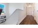 Hallway with luxury vinyl plank flooring and staircase detail at 8478 Karrer Ter, Orlando, FL 32827