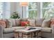 Close-up of a living room featuring a comfortable sofa, stylish coffee table, and bright natural lighting at 8478 Karrer Ter, Orlando, FL 32827