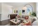 Cozy living room featuring a comfortable sofa, stylish coffee table, and plenty of natural light at 8478 Karrer Ter, Orlando, FL 32827