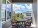 Outdoor patio with comfortable seating and a view of the surrounding neighborhood under a partly cloudy sky at 8478 Karrer Ter, Orlando, FL 32827