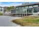 Canvas Restaurant & Market exterior view featuring lakeside dining and modern architectural design at 8478 Karrer Ter, Orlando, FL 32827