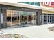 Modern building entrance featuring glass doors, stone accents, and clear signage for easy access to 101 EOLA at 101 S Eola Dr # 810, Orlando, FL 32801