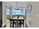 Modern dining area with large windows offering natural light and views of the horizon at 101 S Eola Dr # 810, Orlando, FL 32801