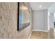 Hallway featuring a decorative accent wall with an art piece and leading to additional living spaces in the home at 101 S Eola Dr # 810, Orlando, FL 32801