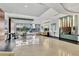 Bright lobby with high ceilings, stylish seating, modern lighting, and expansive windows overlooking the street at 101 S Eola Dr # 810, Orlando, FL 32801