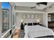 Well-lit main bedroom with floor-to-ceiling windows and stylish decor creates a relaxing space at 101 S Eola Dr # 810, Orlando, FL 32801