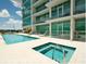 Relaxing pool area with a jacuzzi and ample room for entertaining and socializing with building residents at 101 S Eola Dr # 810, Orlando, FL 32801