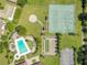 An aerial view of community sports amenities featuring a pool, tennis courts, bocce ball, and shuffleboard at 10148 Eventide Ct, Orlando, FL 32821