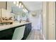 Bright bathroom with black cabinets, marble countertop and double sinks at 10148 Eventide Ct, Orlando, FL 32821