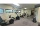 A brightly lit fitness center featuring modern exercise equipment and a spacious layout at 10148 Eventide Ct, Orlando, FL 32821