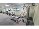 A community gym featuring cardio and weight machines with mirrors and bright lighting at 10148 Eventide Ct, Orlando, FL 32821