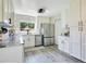 Bright kitchen features stainless steel appliances, granite countertops, and white cabinets at 10148 Eventide Ct, Orlando, FL 32821
