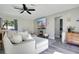 Comfortable living room with a large sectional, fireplace, and neutral decor for relaxation at 10148 Eventide Ct, Orlando, FL 32821