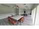 Large recreation room featuring tables, chairs, ceiling fans, and a billiards table at 10148 Eventide Ct, Orlando, FL 32821