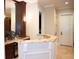 Wet bar area featuring granite countertops, custom cabinets, and elegant lighting fixtures at 11013 Ullswater Ln, Windermere, FL 34786
