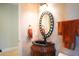Charming bathroom with decorative mirror, ornate sink, and neutral walls, enhancing a warm ambiance at 11013 Ullswater Ln, Windermere, FL 34786