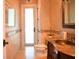 Elegant powder room with decorative walls, mosaic tile accents, and a stylish vessel sink at 11013 Ullswater Ln, Windermere, FL 34786