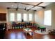 Spacious room with coffered ceiling, natural light, hardwood floors, and play space for the  at 11013 Ullswater Ln, Windermere, FL 34786