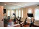 Bright home gym with wood floors, fitness equipment, and large mirrors, perfect for workouts at 11013 Ullswater Ln, Windermere, FL 34786