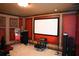 Comfortable home theater room featuring a large screen and popcorn machine, perfect for movie nights at 11013 Ullswater Ln, Windermere, FL 34786