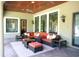 Covered outdoor living area with comfortable seating, perfect for relaxation and entertainment at 11013 Ullswater Ln, Windermere, FL 34786