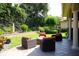 Patio features an outdoor fire pit and lounge chairs in a tranquil backyard setting at 11013 Ullswater Ln, Windermere, FL 34786