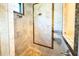 Walk-in shower features multiple shower heads, tile surround, and built-in shelving at 11013 Ullswater Ln, Windermere, FL 34786