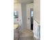 Updated bathroom with tile flooring, decorative rug and towel, marble counters and updated fixtures at 116 Blackwater Ct, Kissimmee, FL 34743