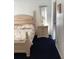 Bright bedroom with an elegant bed frame and a view of the closet at 116 Blackwater Ct, Kissimmee, FL 34743