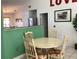 Charming dining area features a round table with seating for four at 116 Blackwater Ct, Kissimmee, FL 34743