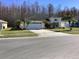 Charming single-Gathering home with a two-car garage, lush landscaping, and a well-maintained front yard at 116 Blackwater Ct, Kissimmee, FL 34743