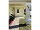 Welcoming covered front porch with decorative columns, plants, and house number 116 at 116 Blackwater Ct, Kissimmee, FL 34743