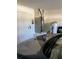 Garage featuring a water heater, AC unit, and access to the home's interior at 116 Blackwater Ct, Kissimmee, FL 34743