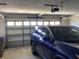 Attached two-car garage offers secure parking and storage space for vehicles and tools at 116 Blackwater Ct, Kissimmee, FL 34743