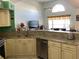 Open concept kitchen features granite counters, stainless appliances, and access to the living room at 116 Blackwater Ct, Kissimmee, FL 34743