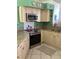 Updated kitchen features granite countertops, stainless appliances, and ample cabinet space at 116 Blackwater Ct, Kissimmee, FL 34743