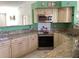 Stylish kitchen with stainless steel appliances, granite countertops, and ample cabinetry for storage at 116 Blackwater Ct, Kissimmee, FL 34743
