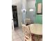 Cozy kitchenette features a breakfast nook with charming table and chairs and pantry storage at 116 Blackwater Ct, Kissimmee, FL 34743