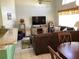 Cozy living room features a vaulted ceiling, large windows, and comfortable seating at 116 Blackwater Ct, Kissimmee, FL 34743