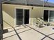 Outdoor patio with comfortable seating and sliding glass doors for easy indoor-outdoor living at 116 Blackwater Ct, Kissimmee, FL 34743