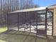 View of the pool enclosure with a lush tree backdrop at 116 Blackwater Ct, Kissimmee, FL 34743