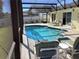 Inviting in-ground pool within a screened lanai, complete with lounge chairs and privacy at 116 Blackwater Ct, Kissimmee, FL 34743