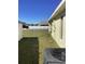 Spacious side yard featuring well-maintained lawn and a view of the neighboring properties at 116 Blackwater Ct, Kissimmee, FL 34743